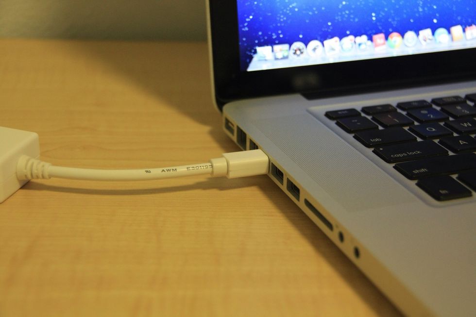 Plug it in the Mini Display Port