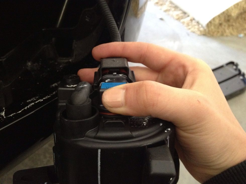 Plug the new fog light unit in.