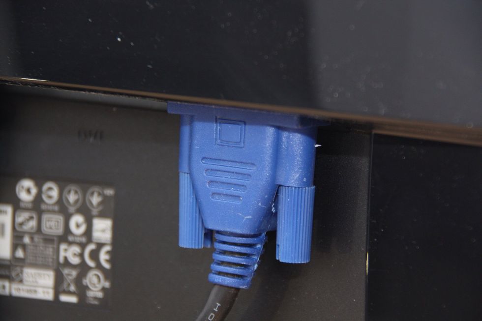 Plug the other end of the cable into the monitor.