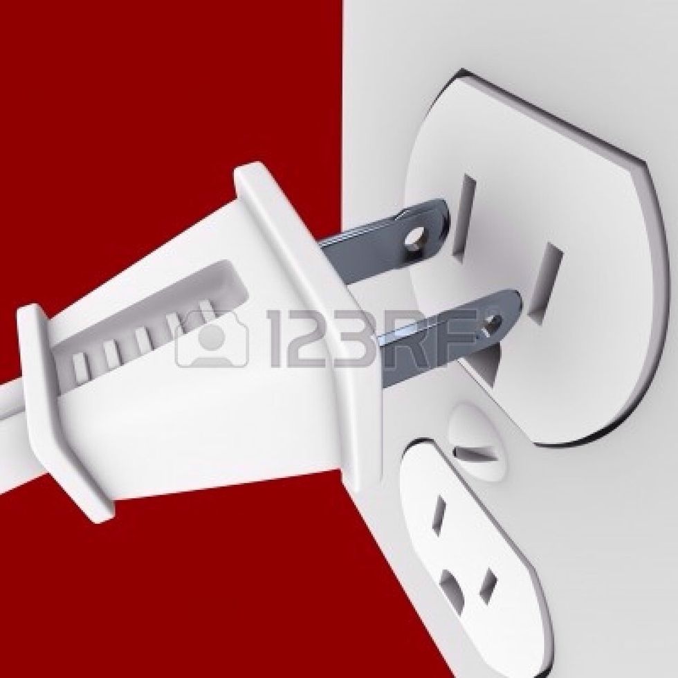 plug the printer cord into the socket then flick the switch