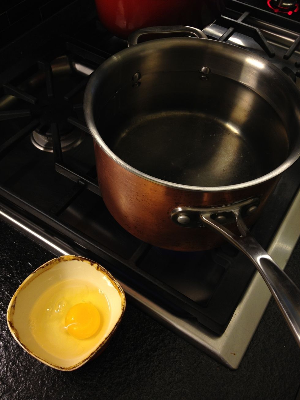 Poach an egg... There's plenty of guides that you can learn from.