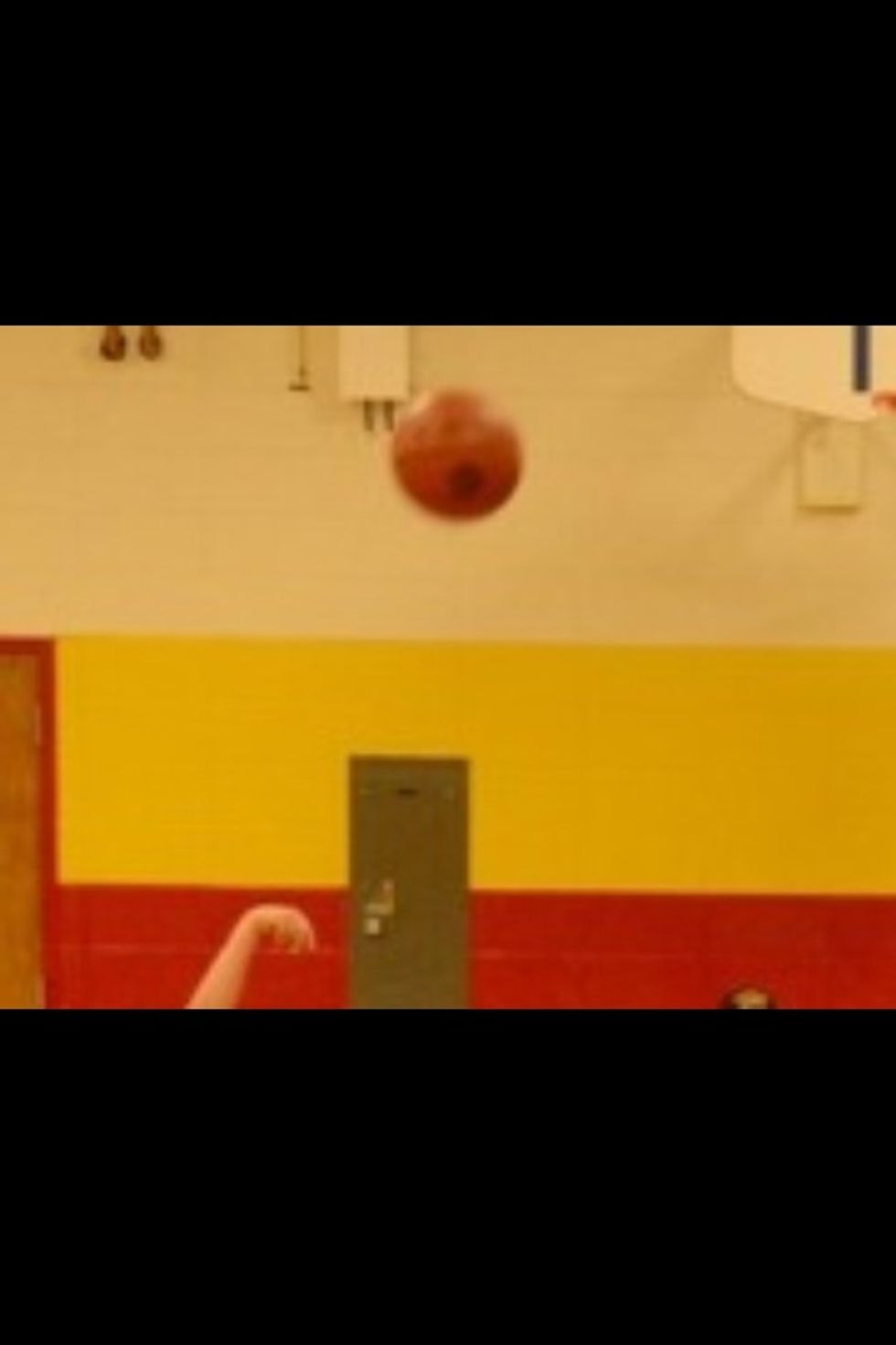 Point your 4 fingers at the rim of the basket while releasing.