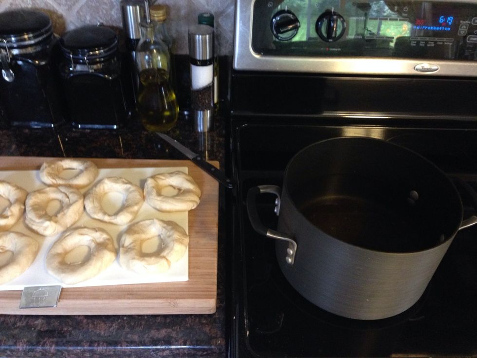 Poke a hole in the middle to form into a bagel. Preheat oven to 425 and bring a pot of water with honey to a boil!