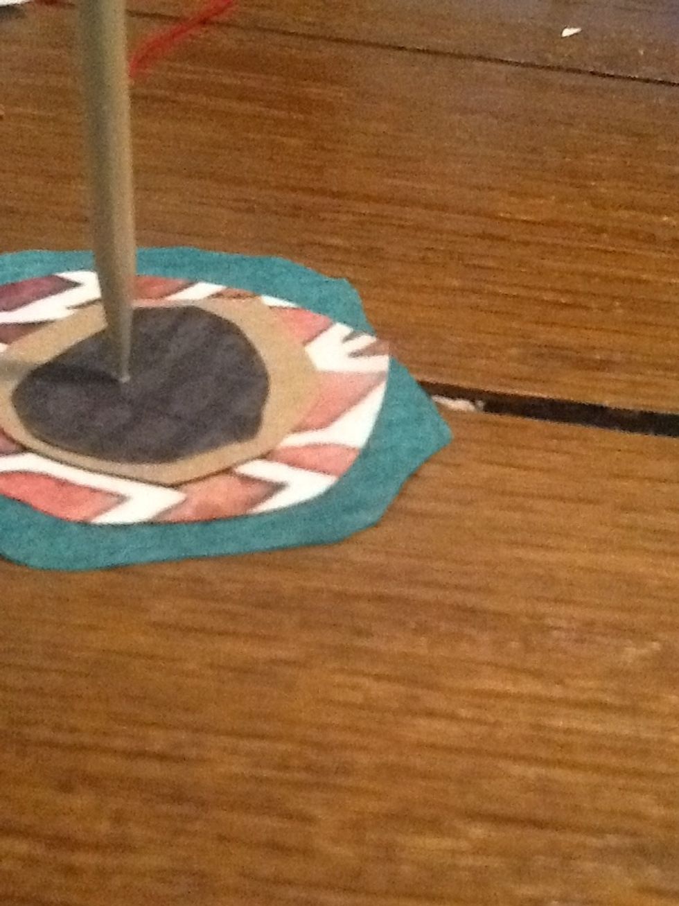 Poke a hole through all the layers with your skewer or awl