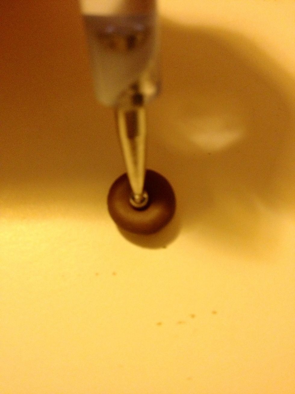 Poke a hole through the middle again.