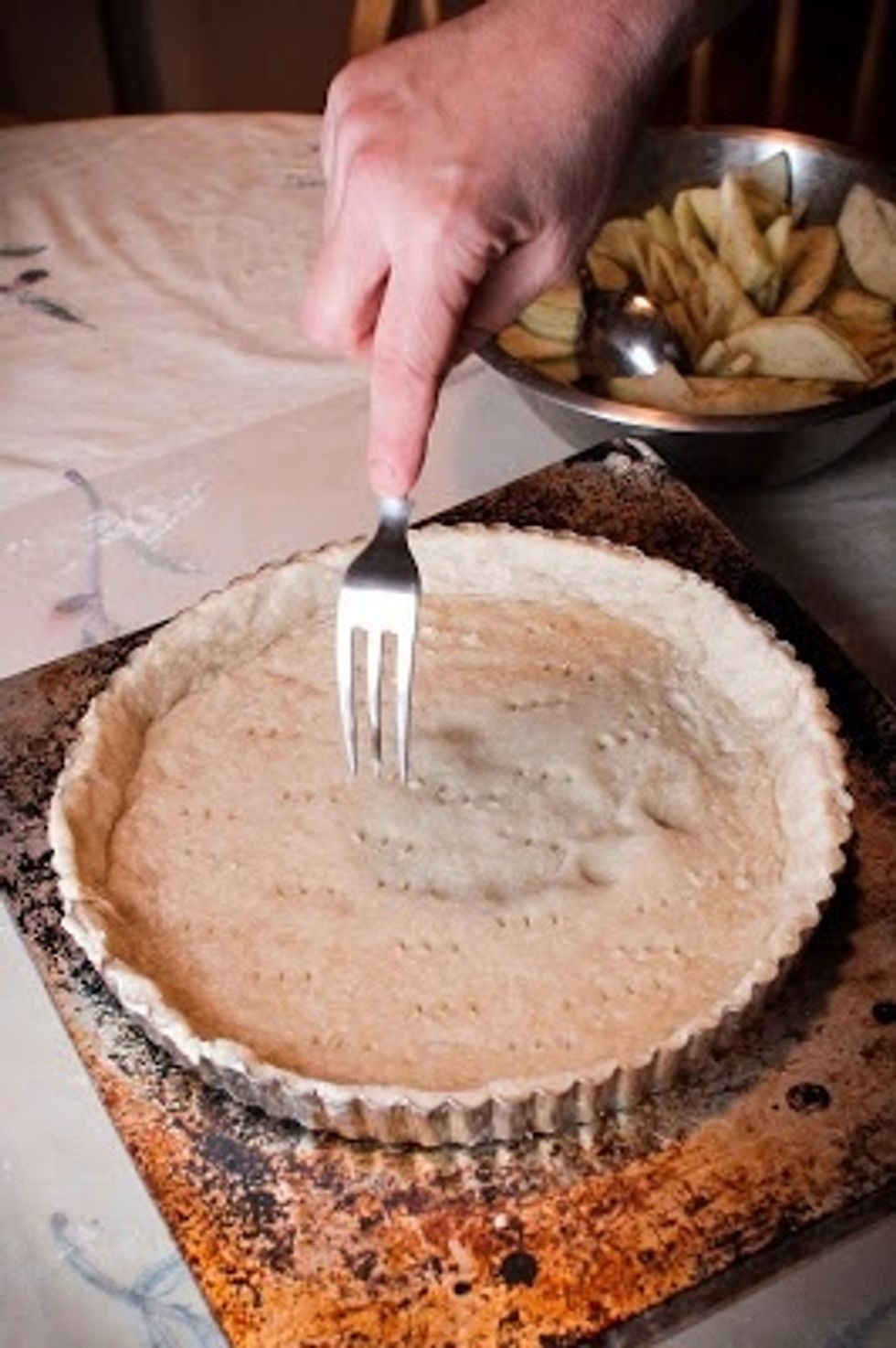 Poke holes in the bottom of the crust with a fork then bake for another 10 minutes. Take the crust out of the oven and raise the temperature to 375 degrees.