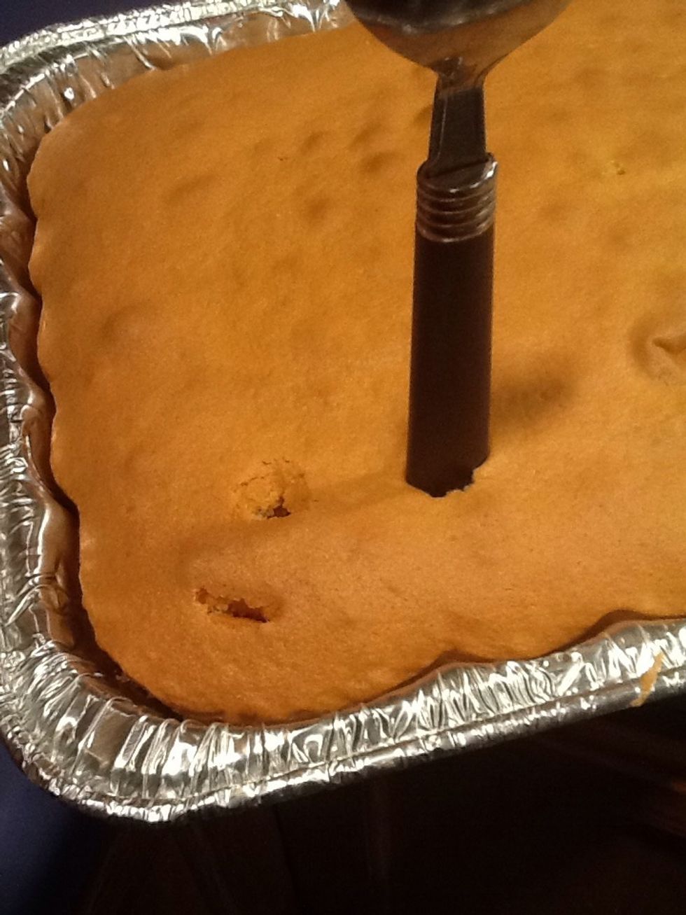 Poke holes in the cake