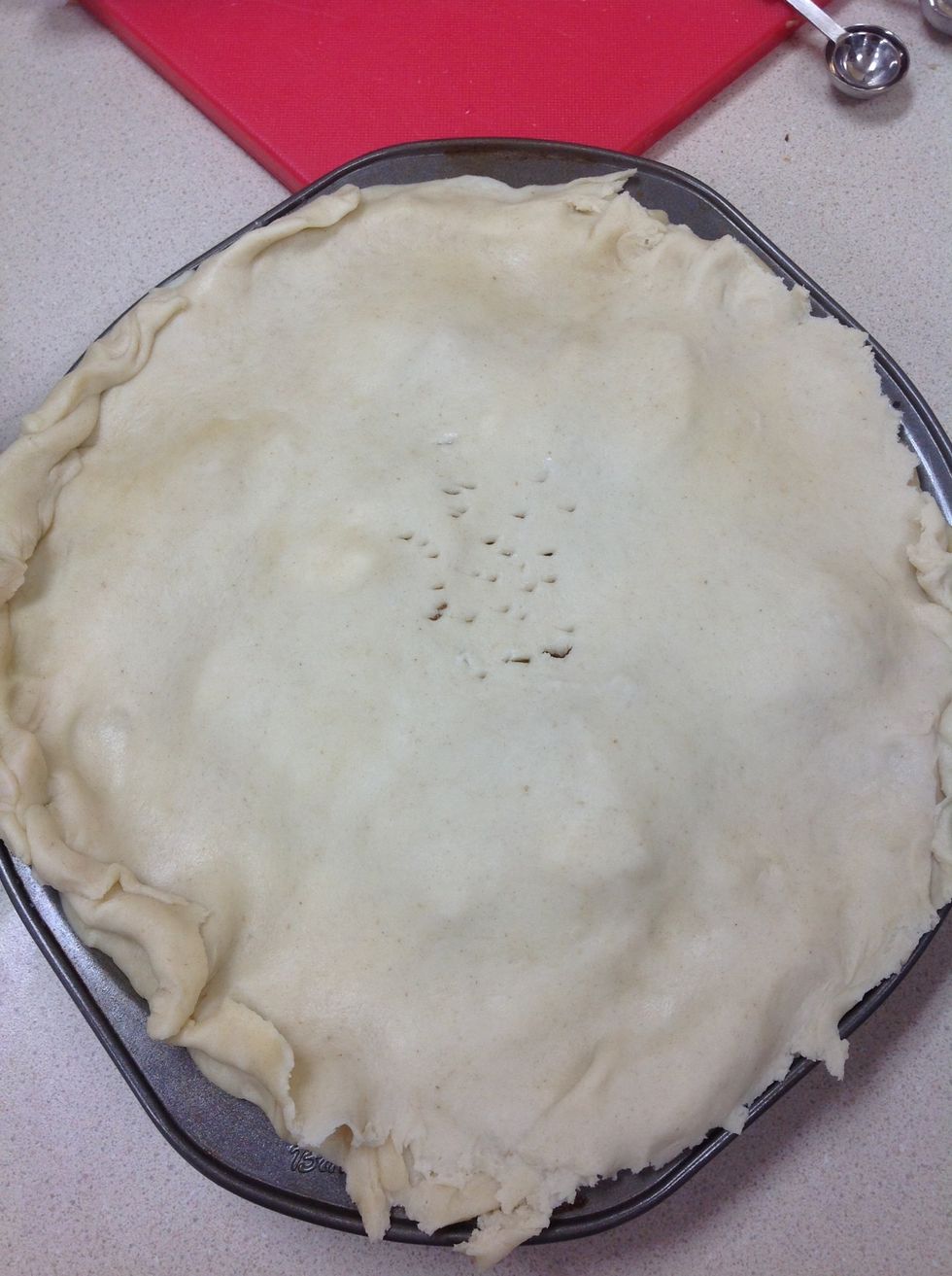 Poke holes into top of pie