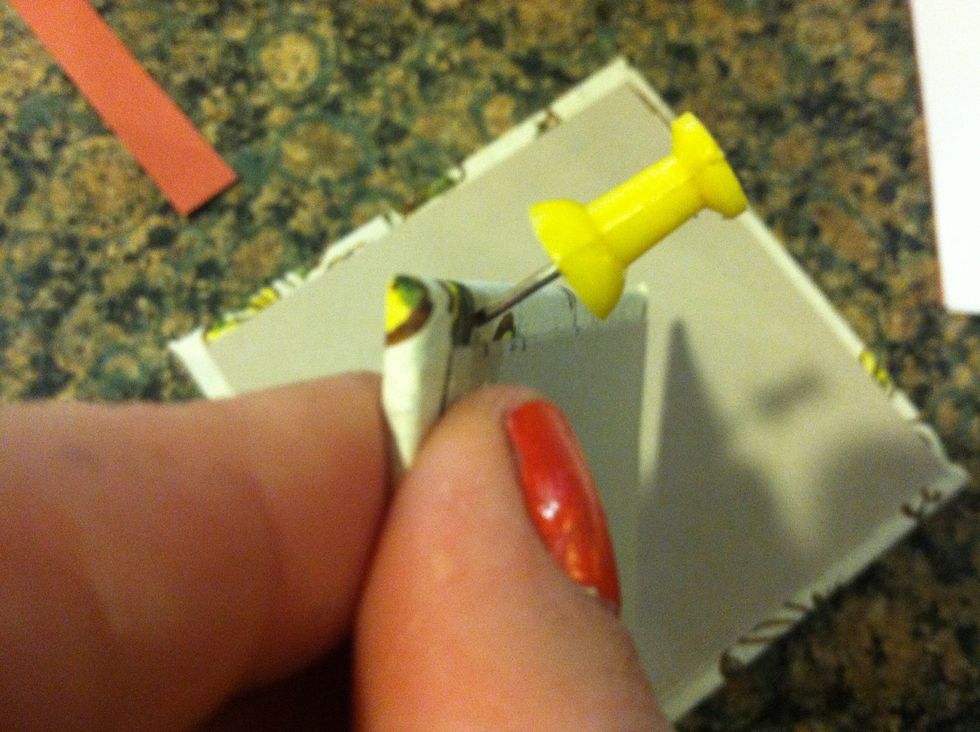 Poke holes with the take on the inside of the cover