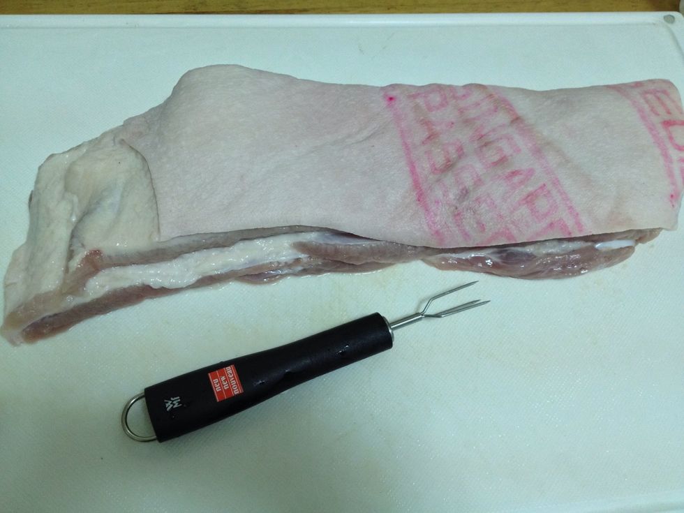 Poke little holes on the skin of the pork.