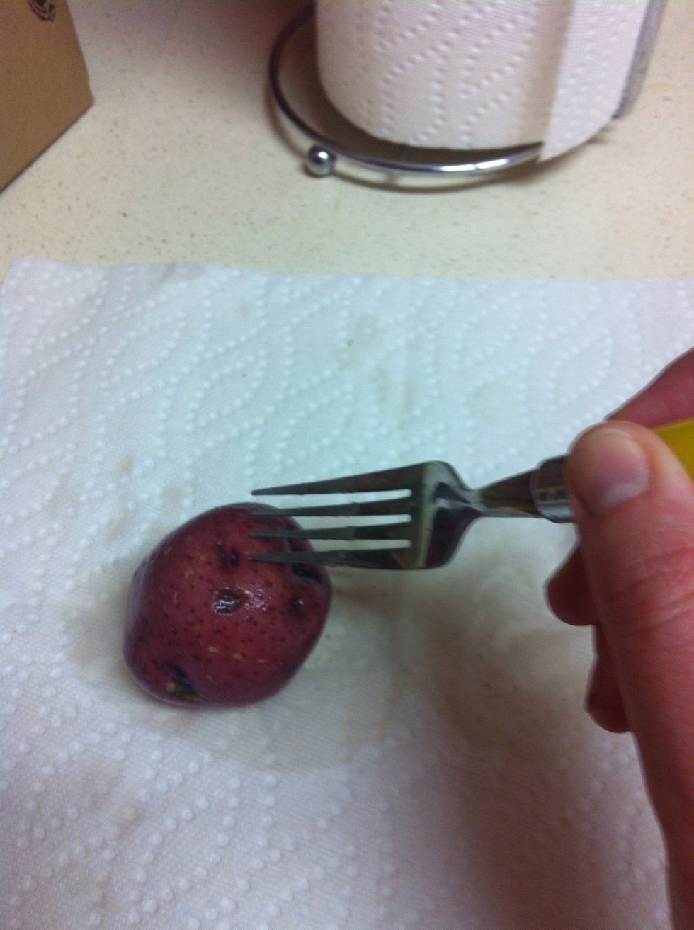 Poke several holes in potato with fork