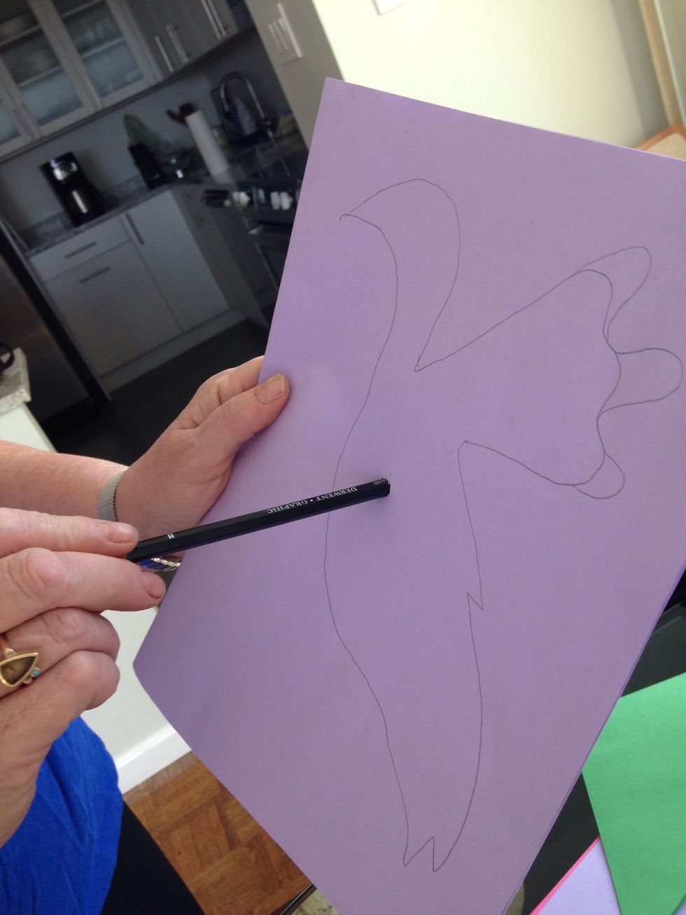 Poke through and cut out shape from 2 layers of paper.