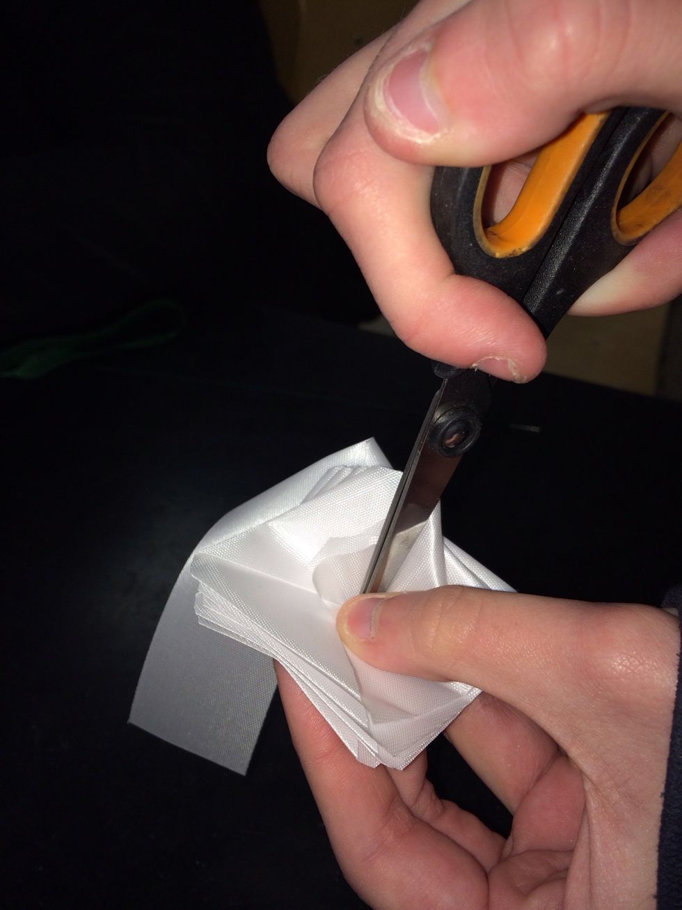 Poke through the loose end of the ribbon