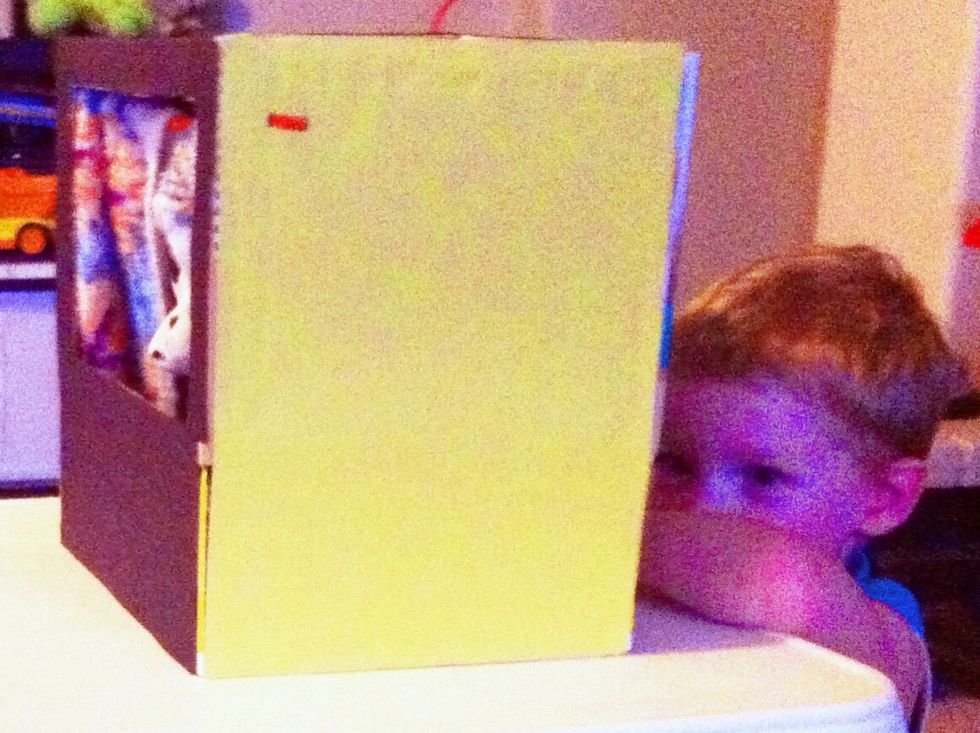 Poke two holes on top/side of box to weave pipe cleaner curtain rod through. Tie off pipe cleaners inside box.