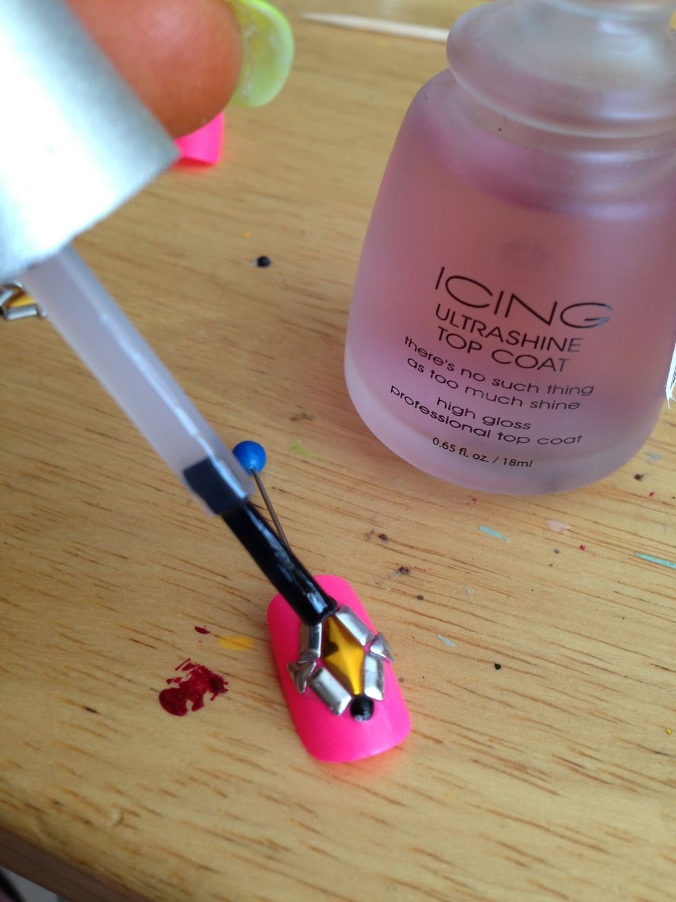 Polish and shine up the the bling with shiny topcoat. Do the bling part first, then the rest of the nail if you decide to use shiny topcoat.