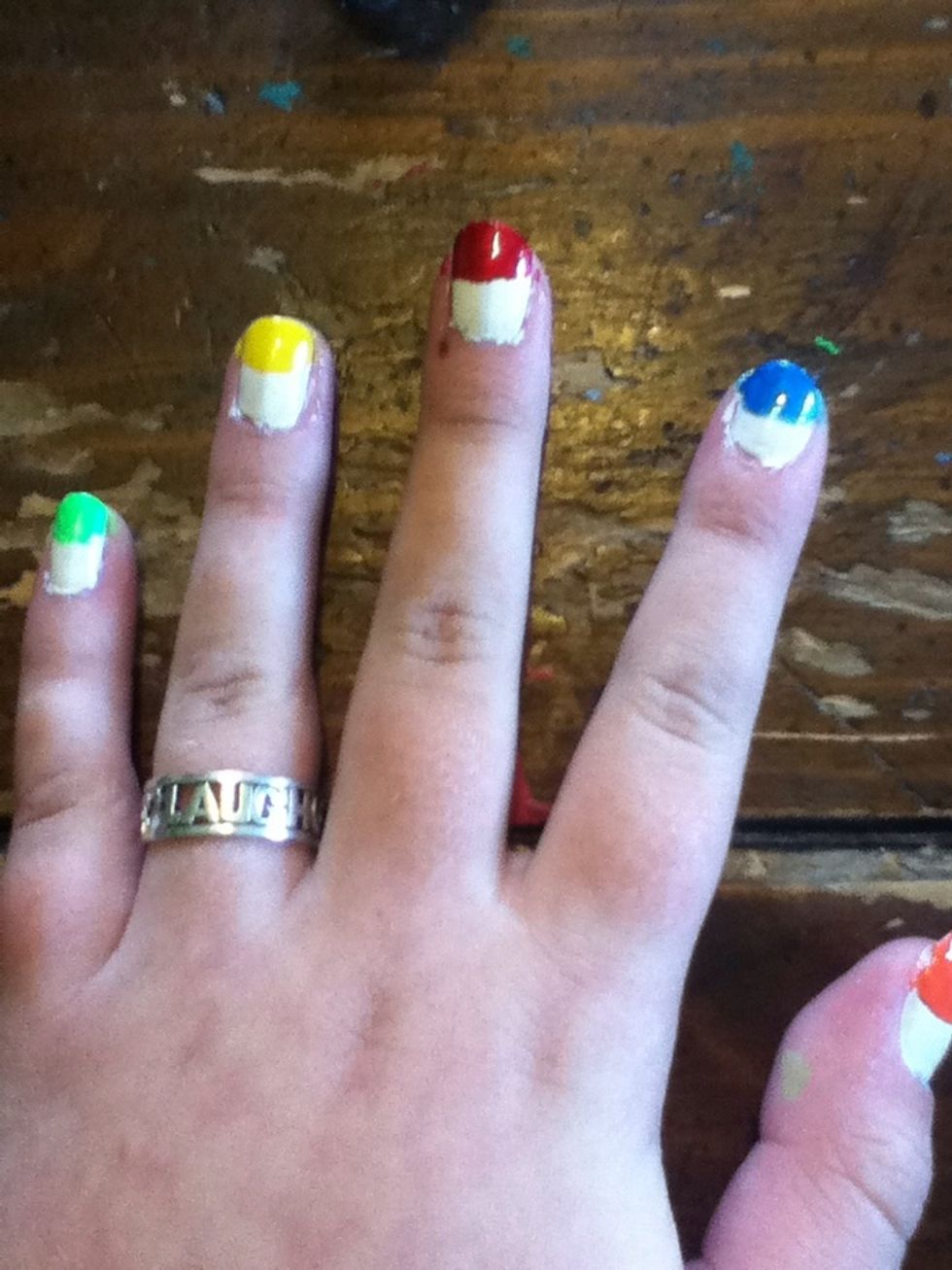 Polish half an M&M on each nail. Try to get a nice round shape.