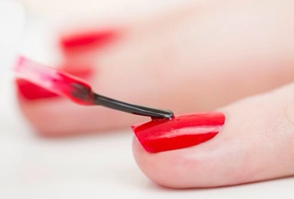 Polish nails with the base color