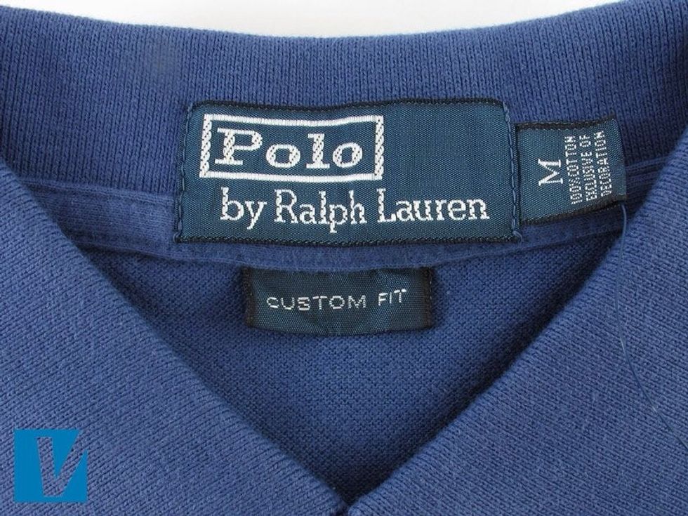 Polo by Ralph Lauren polo shirts feature a branded collar label. Check for errors in spelling, that font shape, size and spacing are consistent with the official Polo by Ralph Lauren logo.