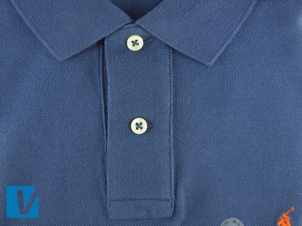 Polo by Ralph Lauren polo shirts traditionally only feature 2 buttons. They are opaque pearl and cross-stitched. Other Ralph Lauren shirt styles will differ from this format.