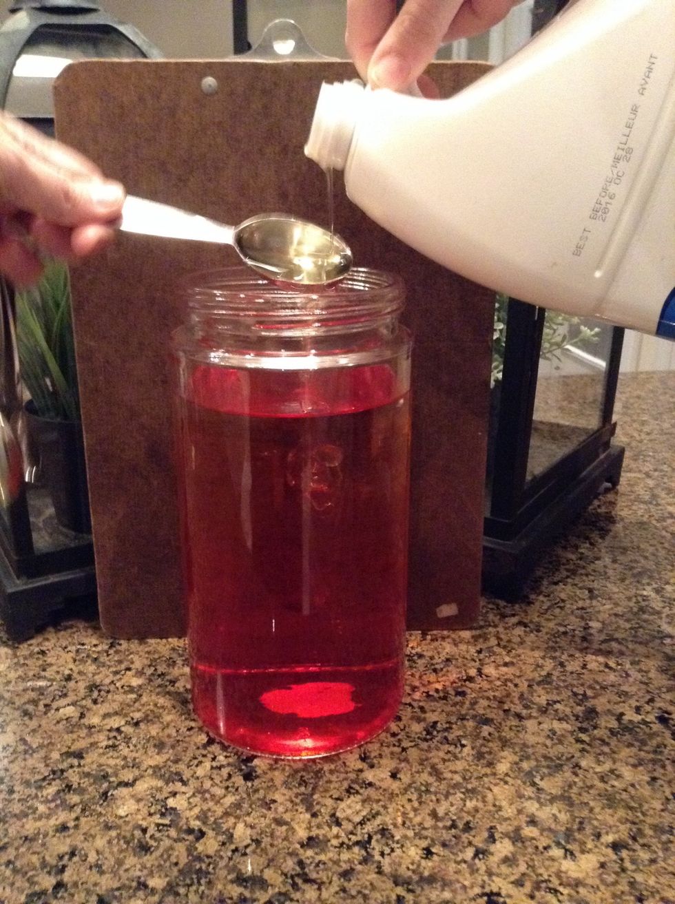 Poor as many tablespoons into your jar of vegetable oil until it meets your liking