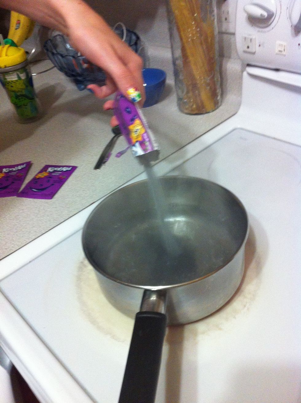 Poor the Kool aid into the pot filled half way of boiling water
