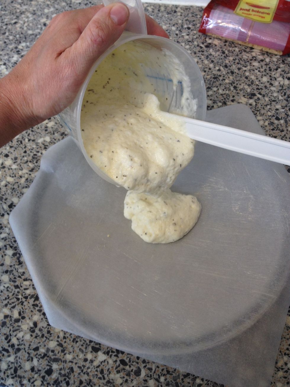 Poor the mix on your greased baking paper and spread out evenly.