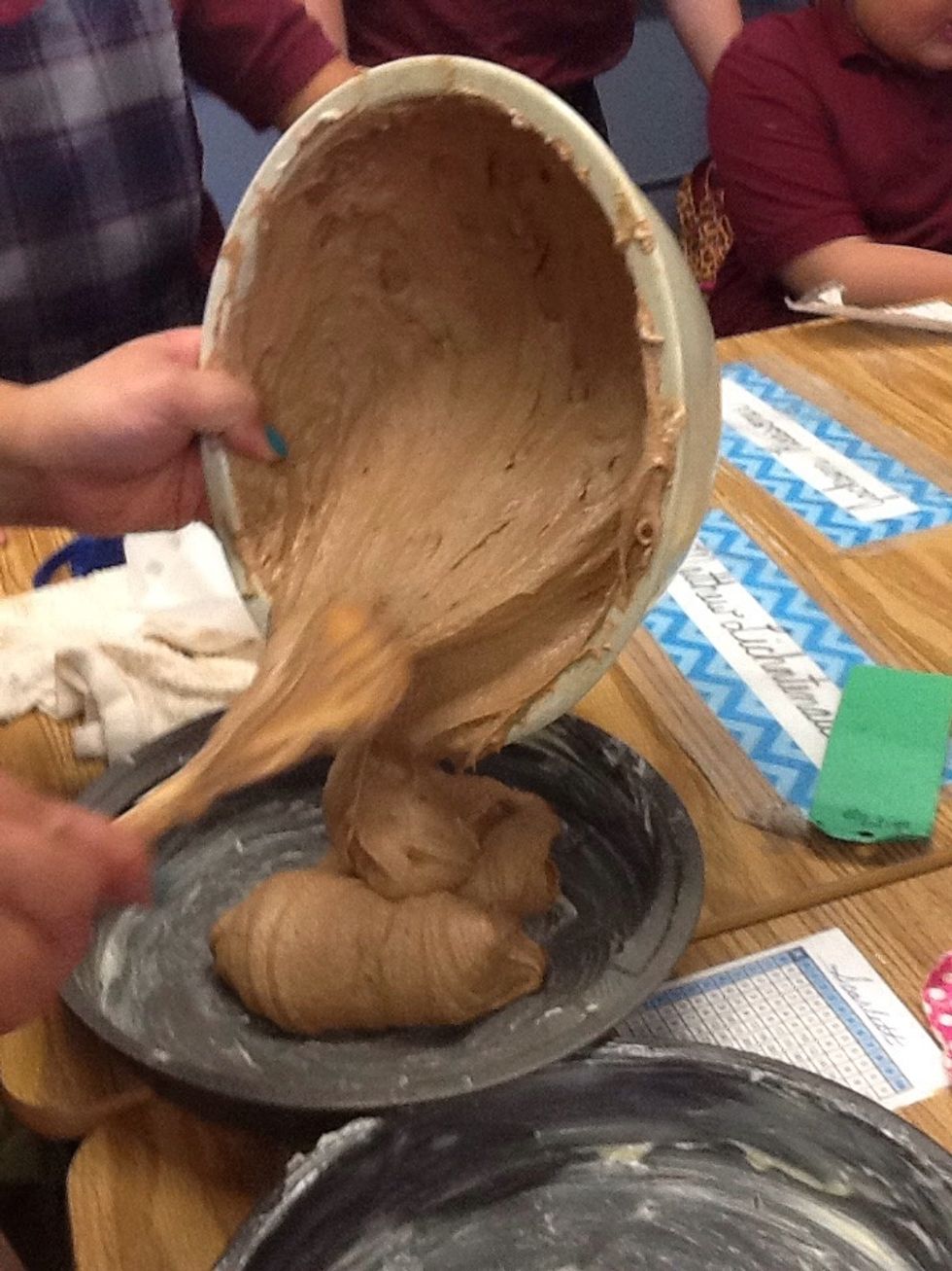 Poor the mixture in the cake pans.