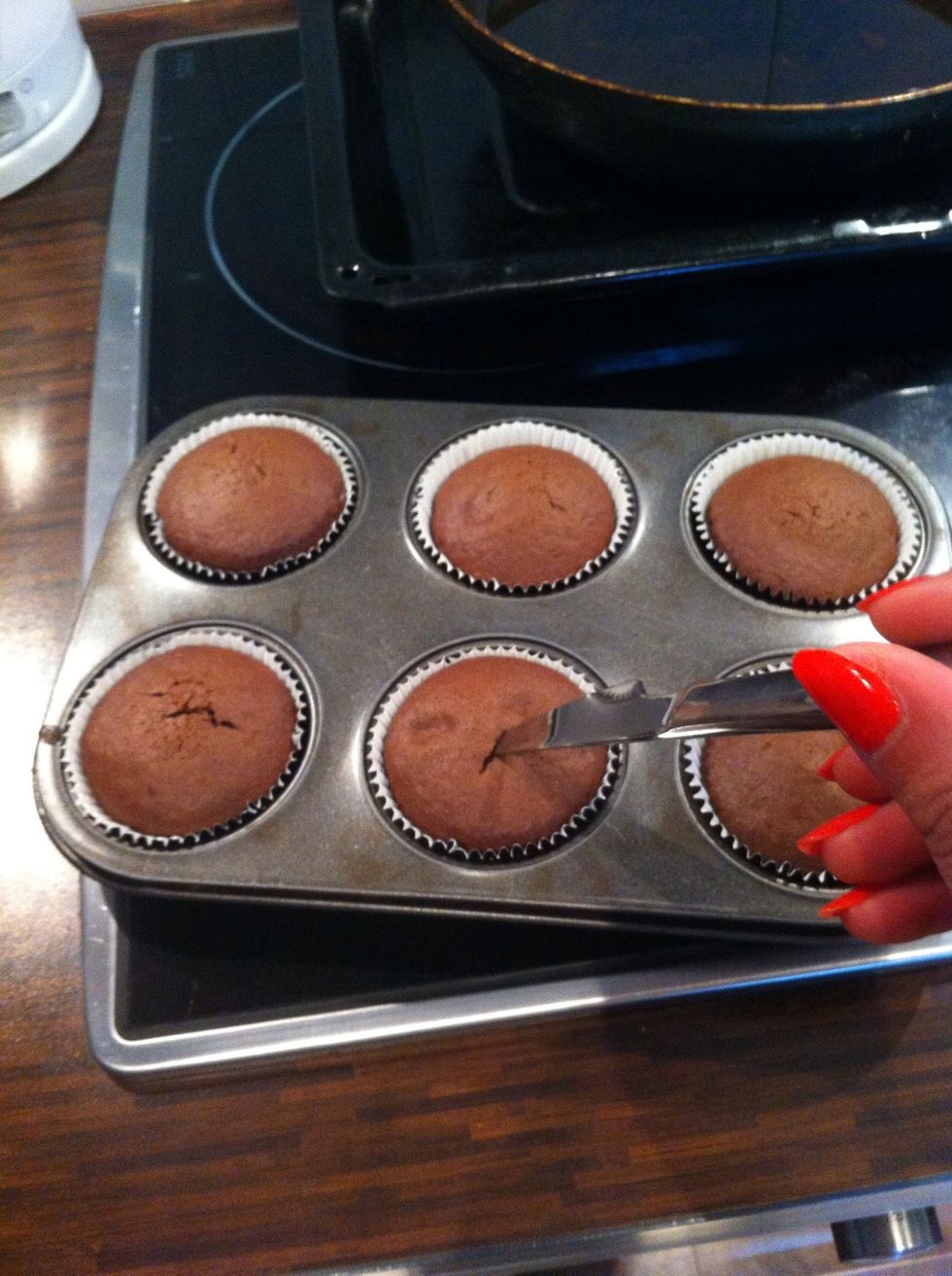 Pop in the oven and when they are ready check them by lightly pushing a sharp knife into one or two. If it comes out clean it's ready!