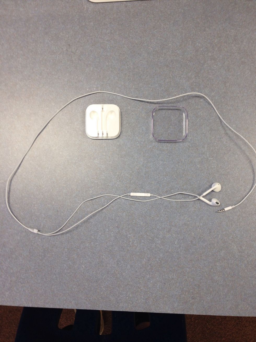Pop open the white plastic Travel Case that came with your Apple EarPods.  Then get your Apple EarPods ready to put into the Travel Case.