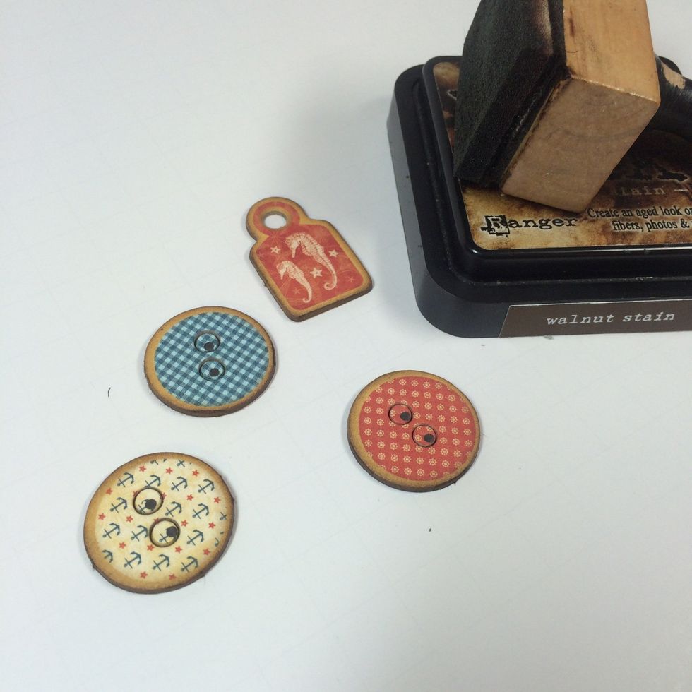 Pop out small chipboard shapes and ink-distress the edges.