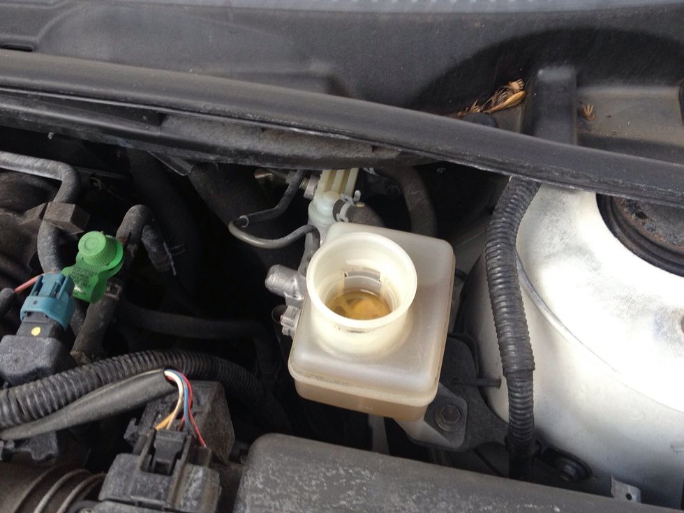 Pop the hood and remove the cap for your brake fluid. Don't forget to put back on when done