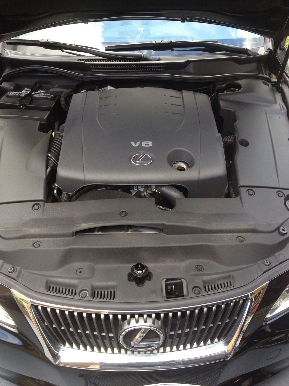 Pop the hood and take the oil cap off, place the oil cap over the hood latch, so if you forget to put the cap back, you can't close the hood