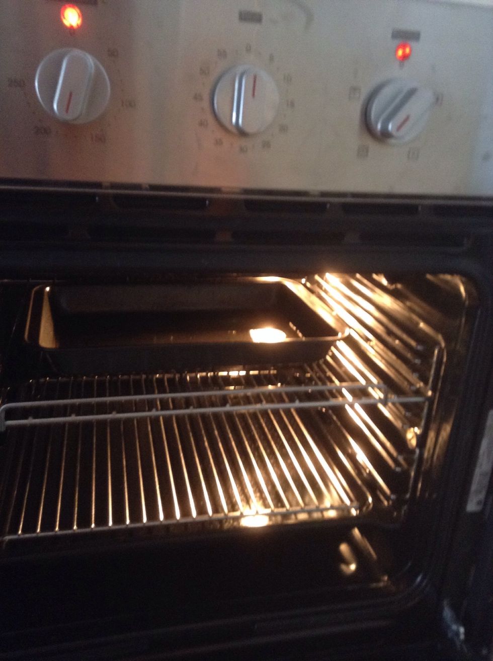 Pop the oiled tray into the oven on a fairly high shelf, set the oven to fan 180. The oil needs to be hot so have the oil in the oven while the potatoes boil.