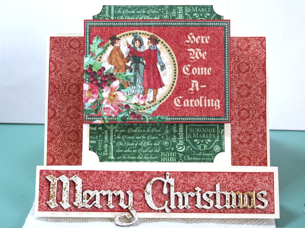 Pop up the ephemera card with foam tape or something similar and adhere about 5/8" from the top of the card as shown.