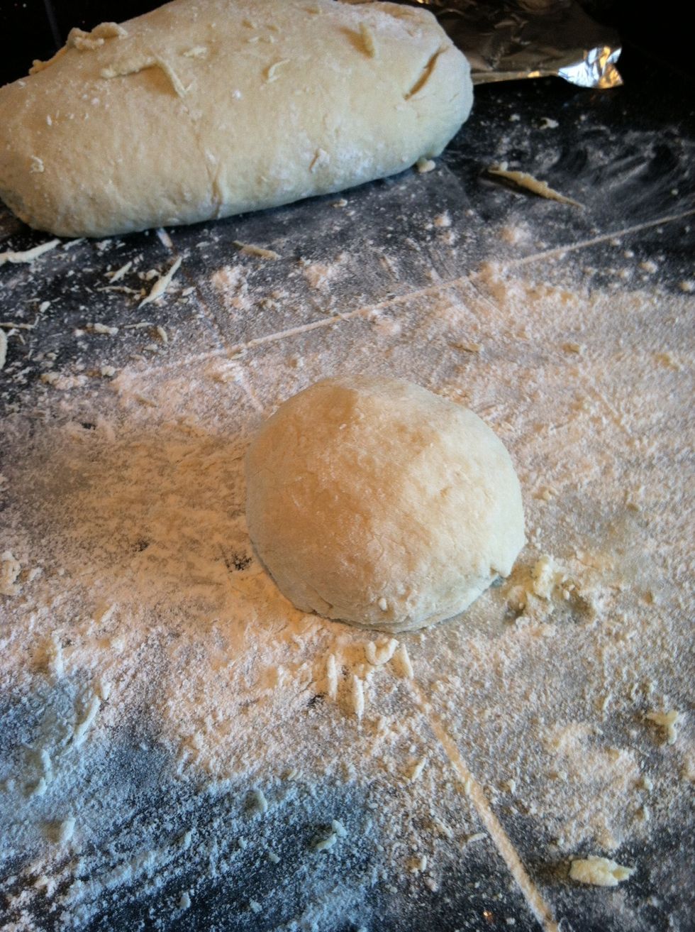 Portion baseball size piece of dough add plenty of flour to prevent from sticking to surface.
