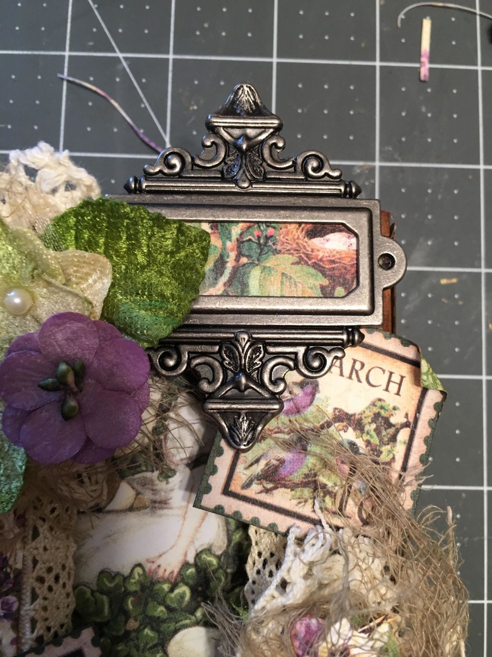 Position and glue the label holder in place at the upper right corner of the lid of the box. Hold until it sets.