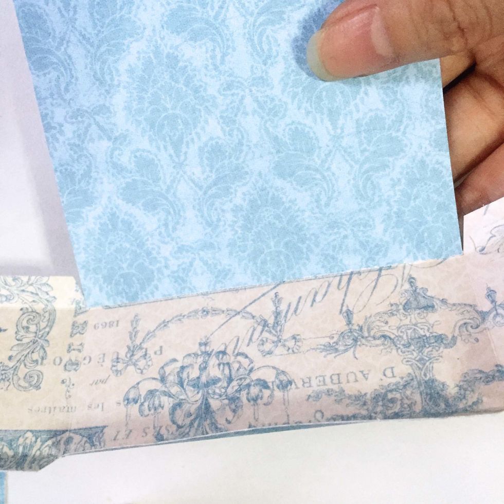 Position and glue the patter paper you've cut from Step 25 as shown.
