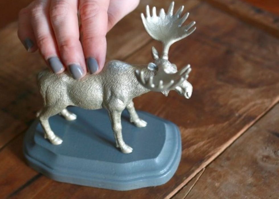 Position and hold the moose down on the plaque, applying light pressure for 30 seconds while the glue adheres.