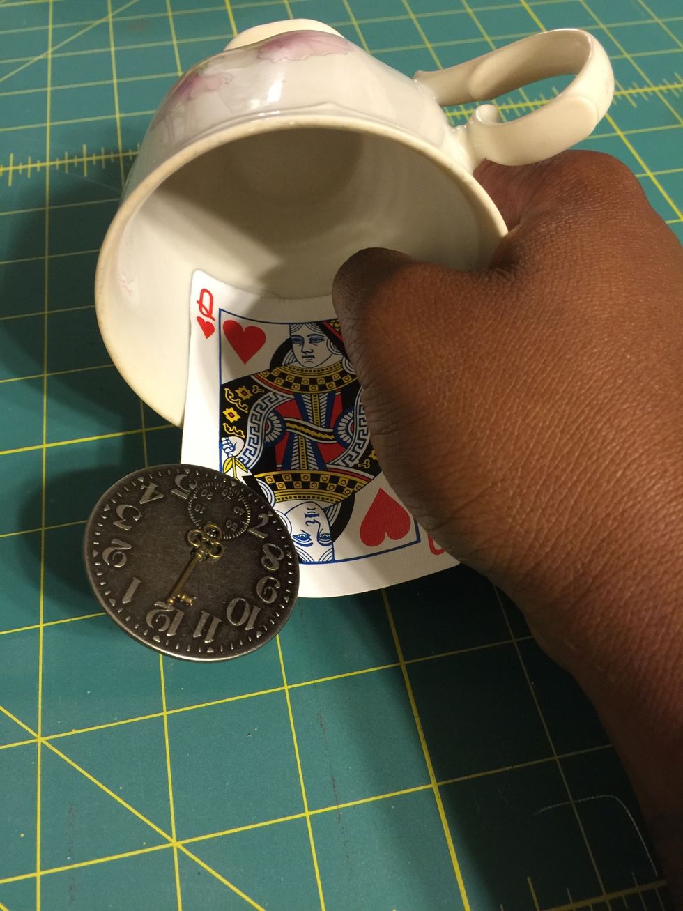 Position card inside of teacup and press to bond.
