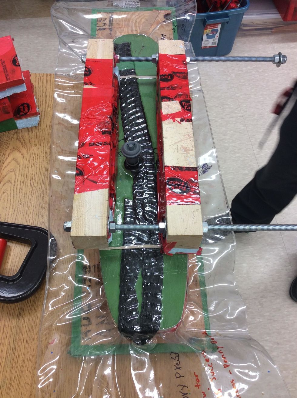 Position Clamping Cauls on vacuum bag.