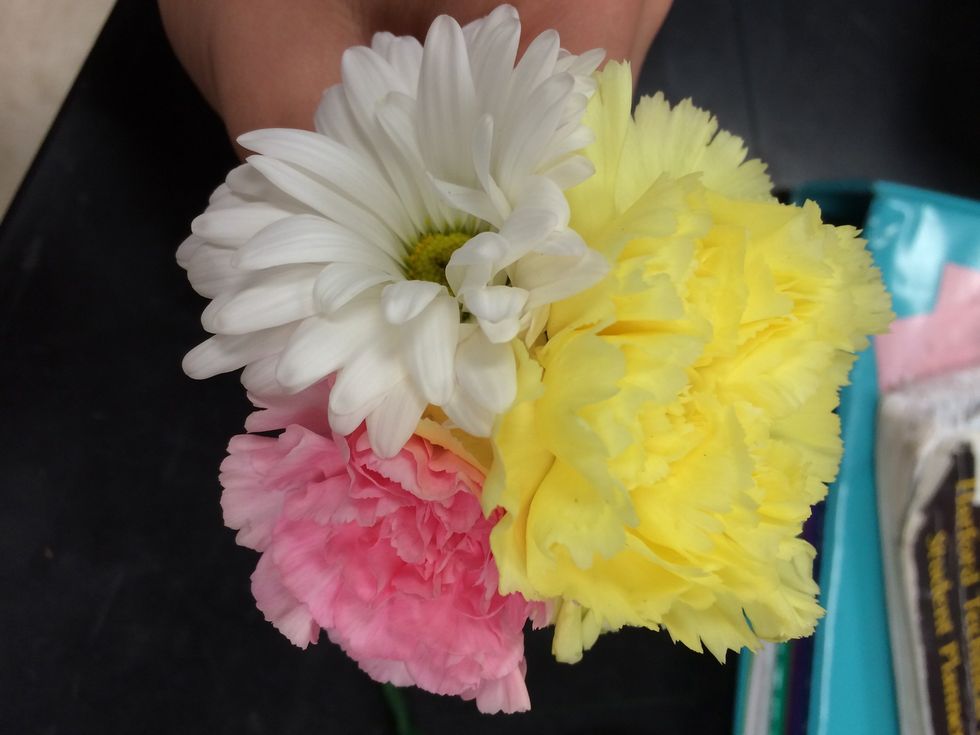 position the flowers the way you want them to look when they are all taped together