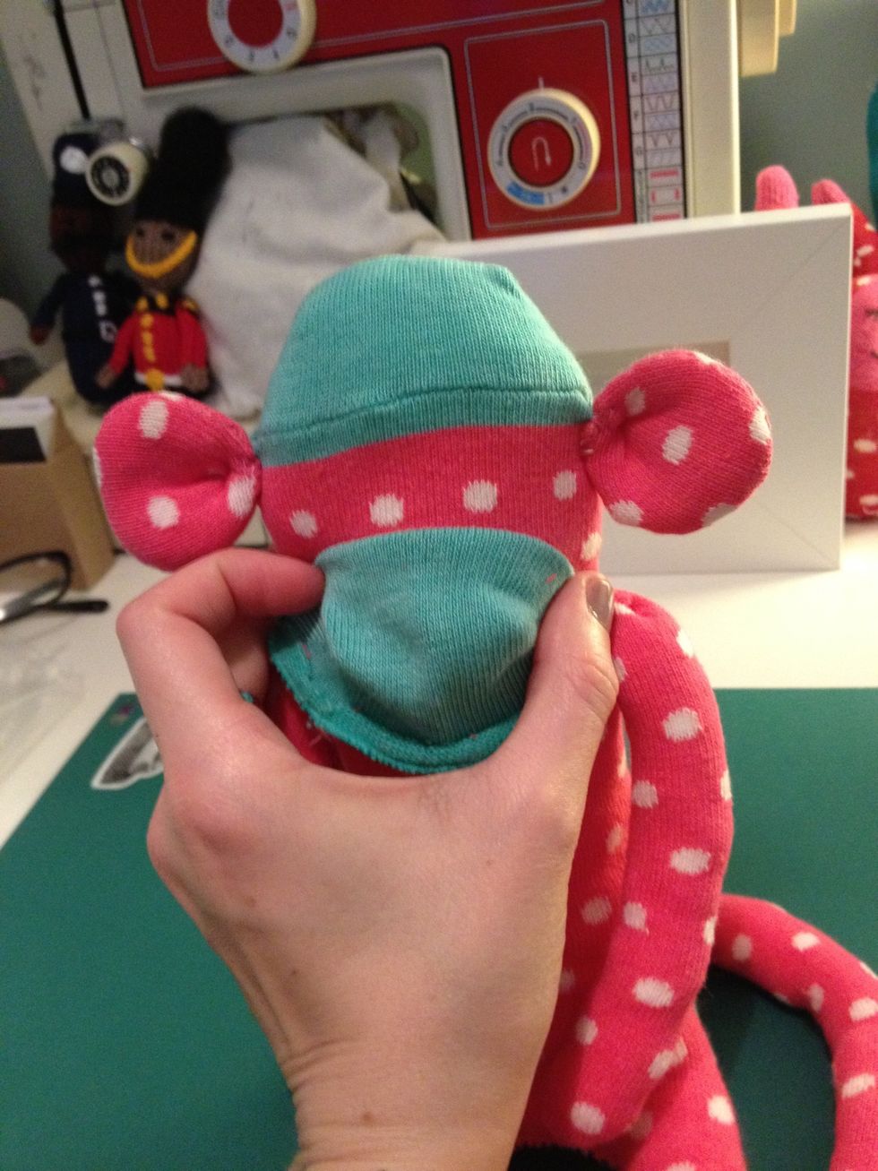 Position the mouth and start to sew it on.