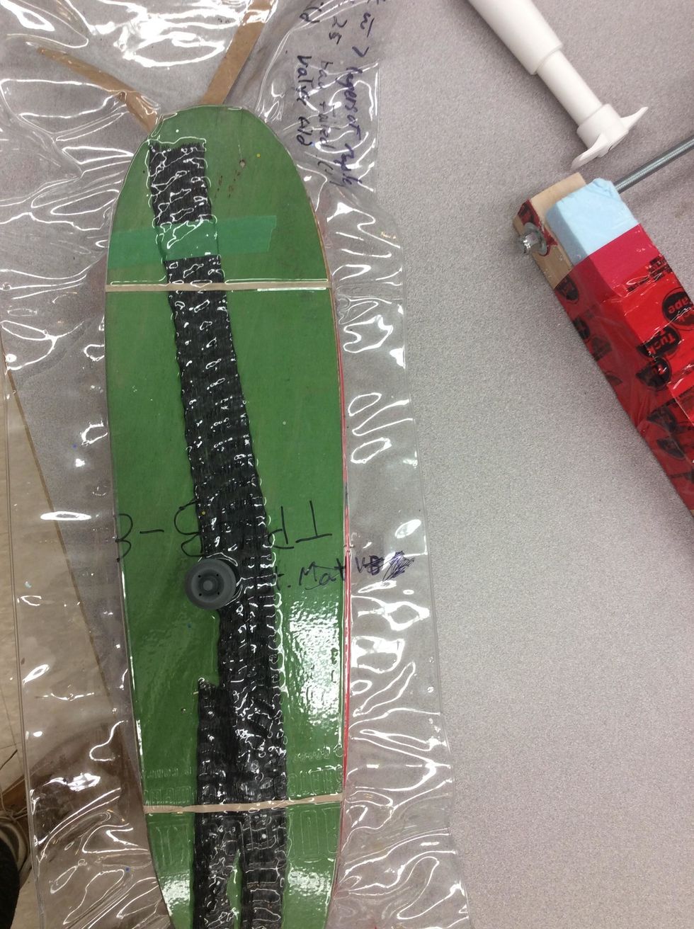 Position vacuum bag on plywood clamping base.