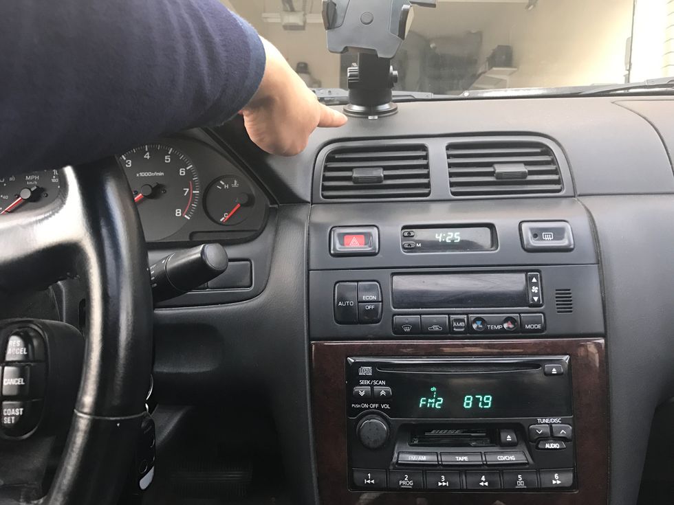 Position your holder at a position that will not interfere with your driving.