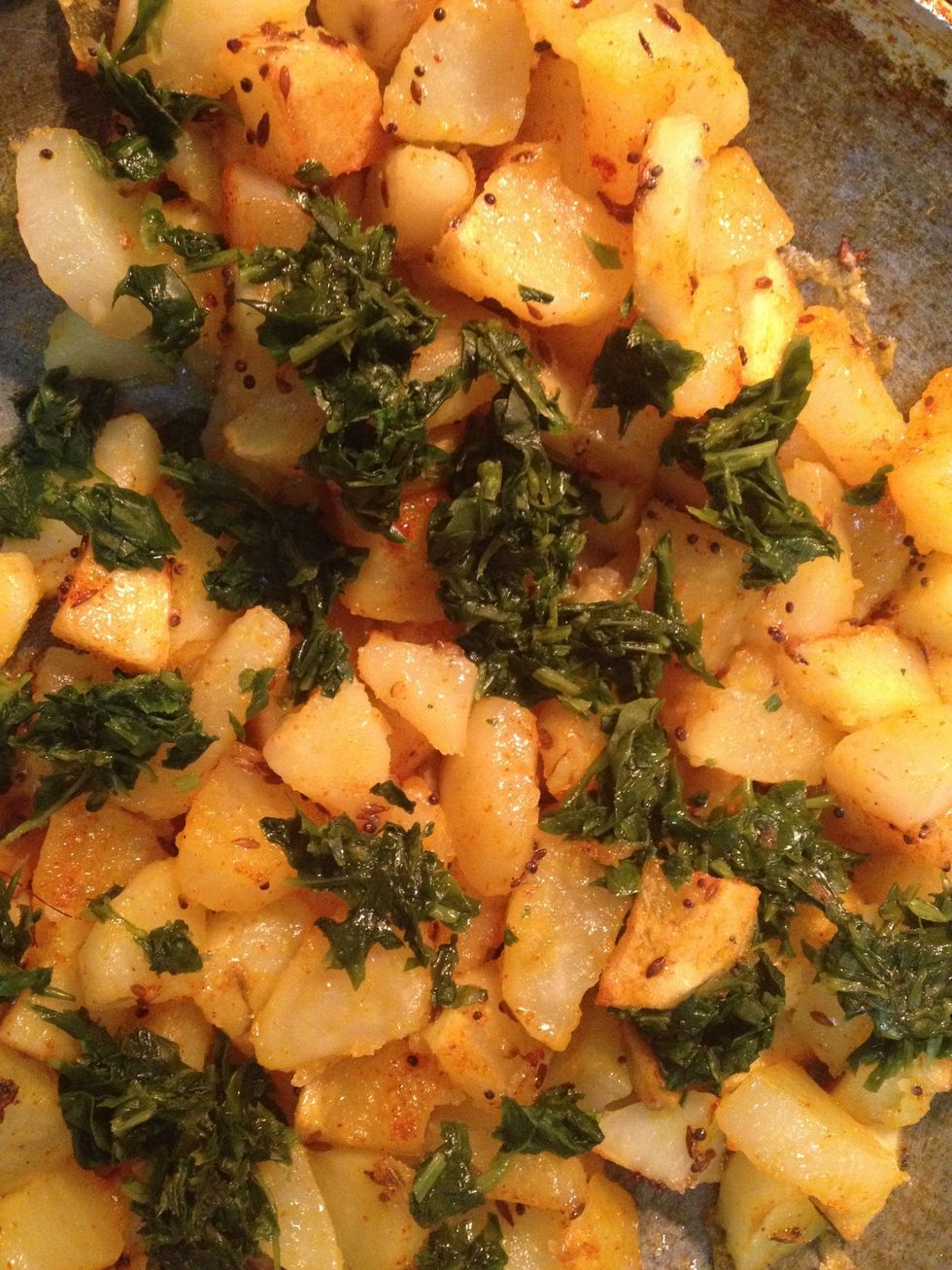 Potatoes are half way cooked now add salt turmeric chilli powder and fenugreek leaves stir it carefully and cover with a lid for 3-4 mins.