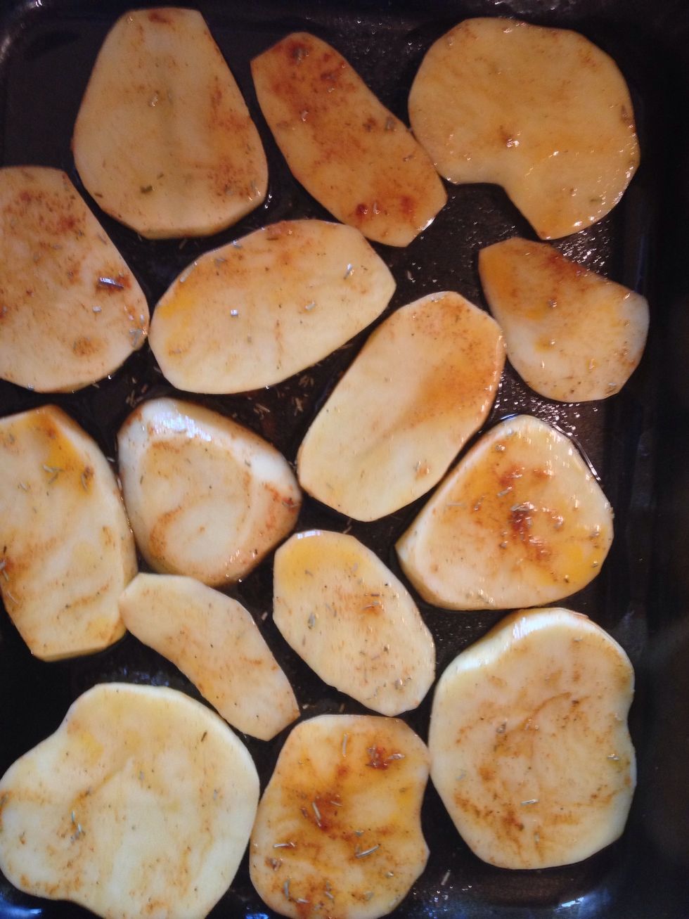 Potatoes ,cut into slices , add some oil, rosemary,pepper,salt,paprika , and bake in 180*C until they are soft, check with a fork