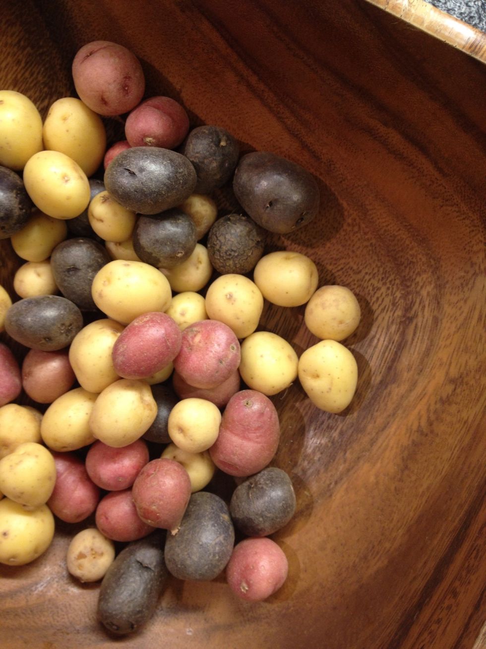 Potatoes. If you don't have small ones don't worry. Boil with skin the big ones (Yukon Gold).