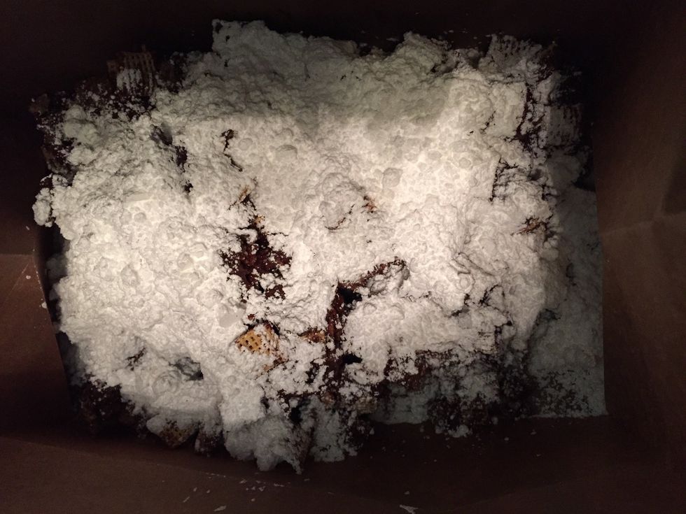 Pour 1 1/2 cups of powdered sugar over the chex in the bag and shake the bag.