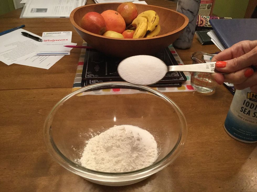 Pour 1/4 cup of salt into the same large glass bowl.