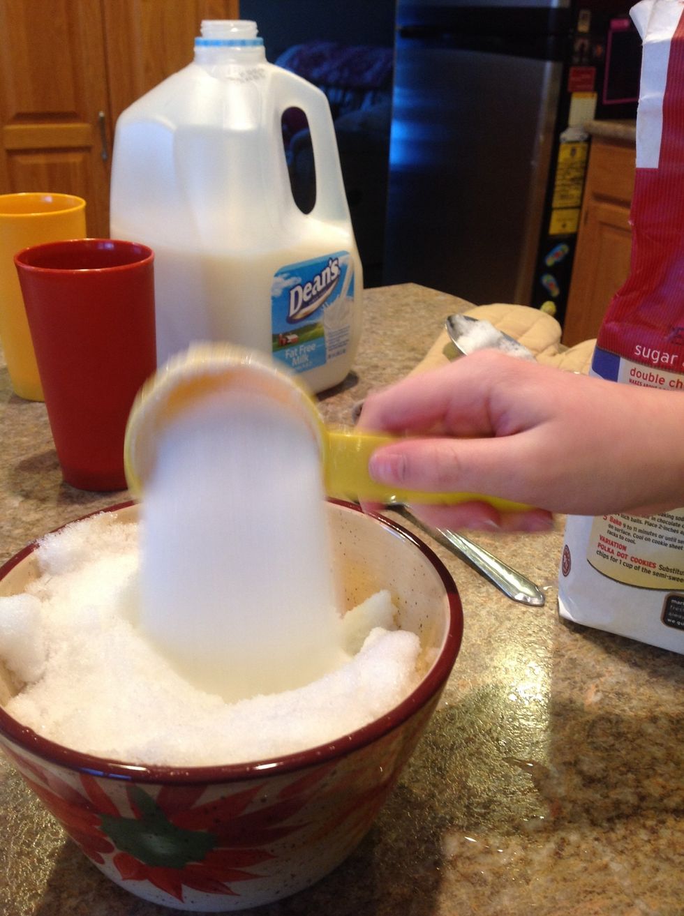 Pour 1/4 cup of sugar into the bowl.